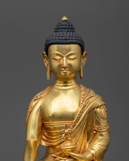 Close up of intricate floral robe carving on Shakyamuni Buddha statue, gold-gilded details.
