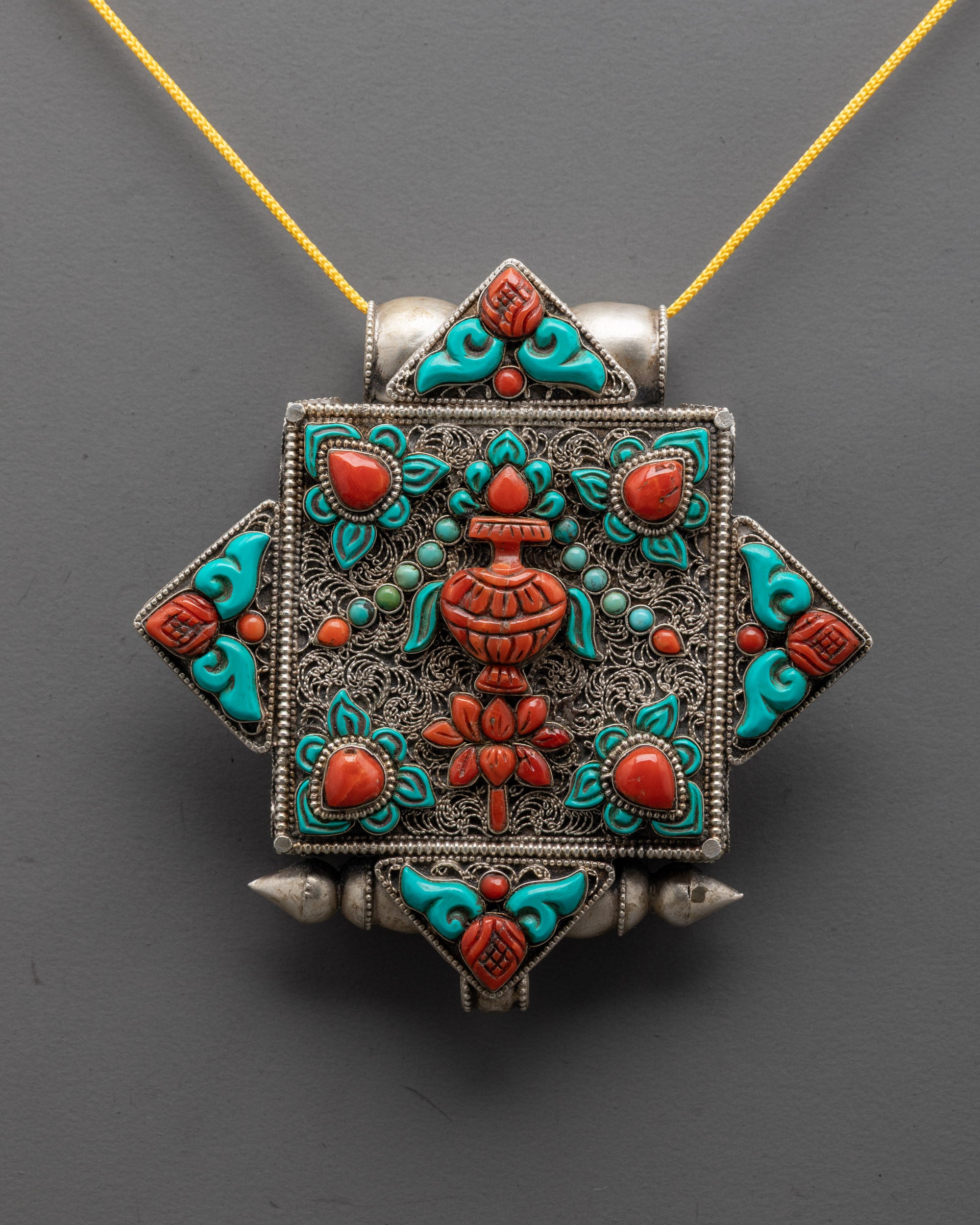 Close up of intricate silver-plated filigree design on Treasure Vase Locket pendant

