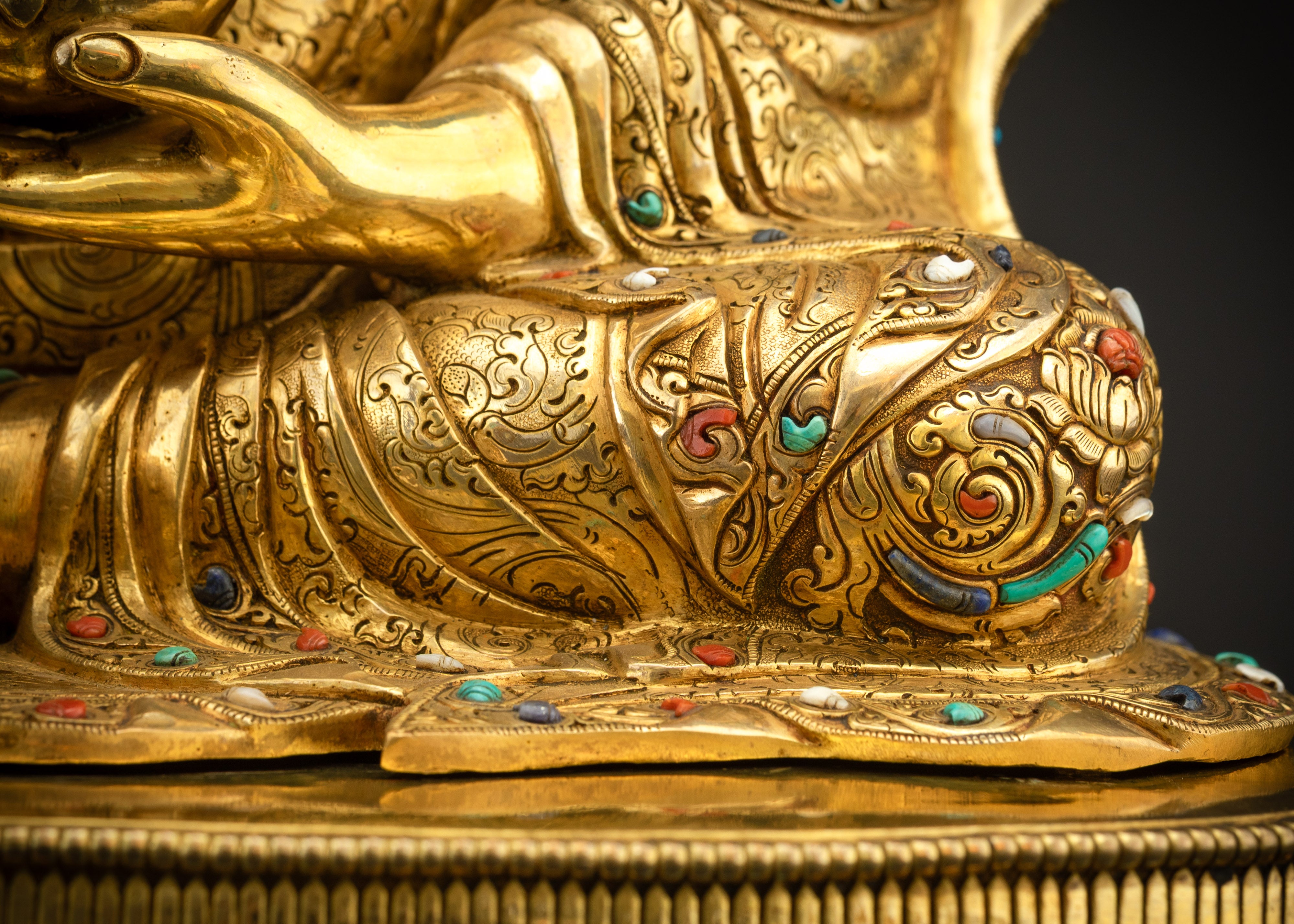 Close up of left side robe showing intricate embroidery and stones
