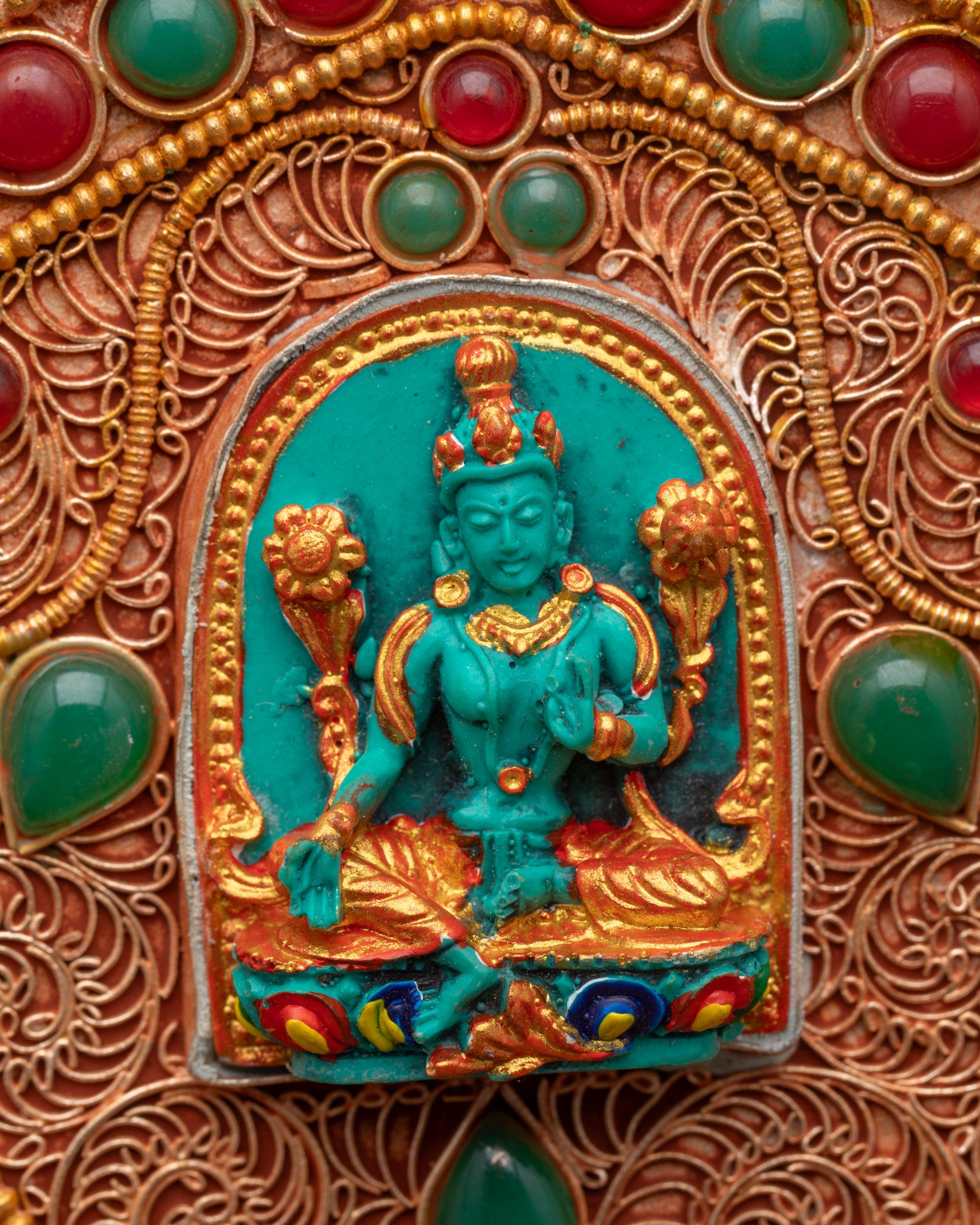 Close up of miniature Green Tara figures on enthroned Bishwo Vajra