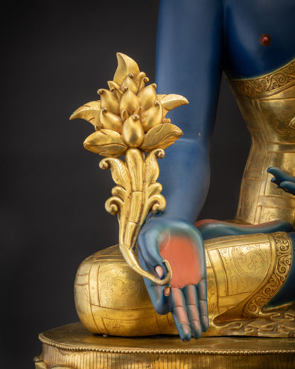 Close up of myrobalan stem held by 44" Bhaisajyaguru Statue with intricate hand-carved details