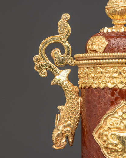 Close up of ornate dragon handle on gold-plated Nepali incense holder