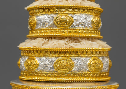 Close up of stackable copper rings with gold-plated symbols on Tibetan Mandala set