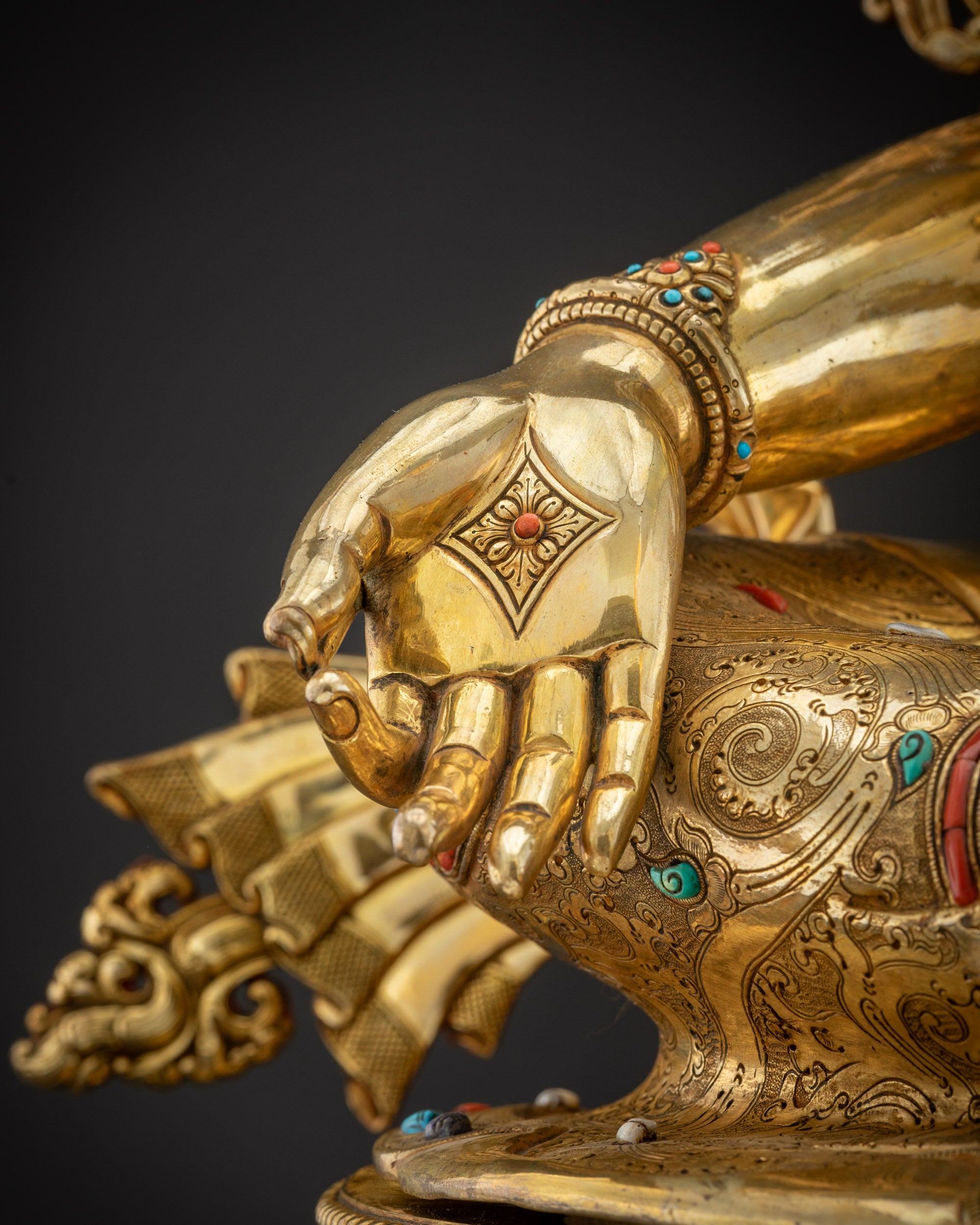 Close up of statue Varada Mudra right Green Tara right hand Varada Mudra blessing gesture
