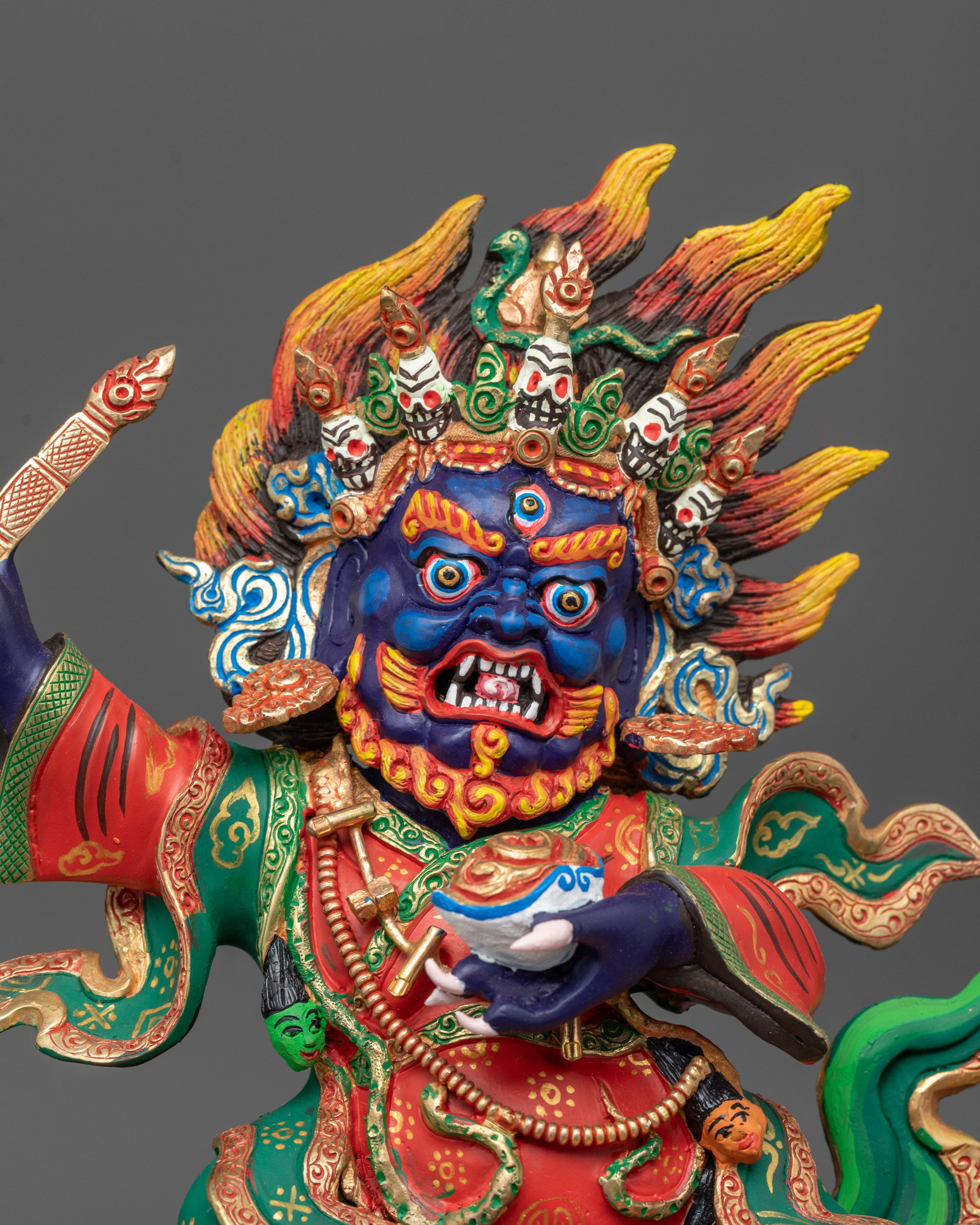 Close up of wrathful Mahakala Bernagchen holding trident and Kartika knife