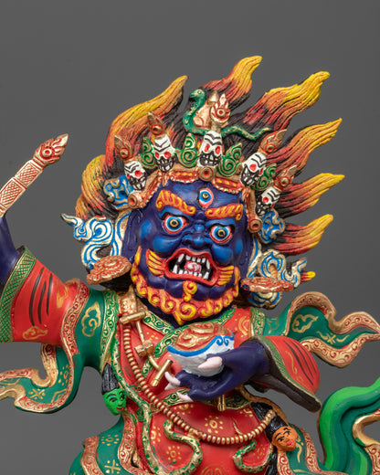 Close up of wrathful Mahakala Bernagchen holding trident and Kartika knife