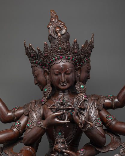 Close up oxidized Namgyalma face and crowns showing sacred symbols in copper
