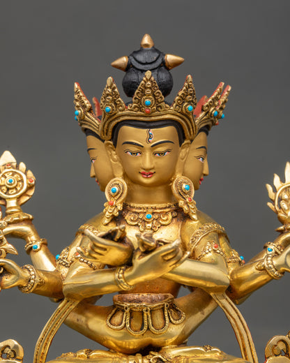 Close up three faces Guhyasamaja gold painted face with semi-precious stone