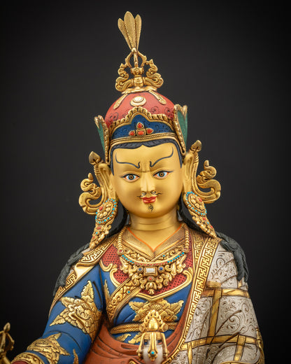 Close up view of Guru Padmasambhava statue highlighting 3D carving and gold gilding