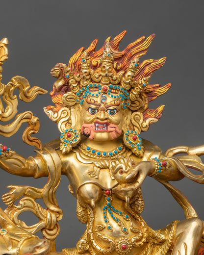 Close view of Palden Lhamo gold-painted face with flaming halo and parasol crown