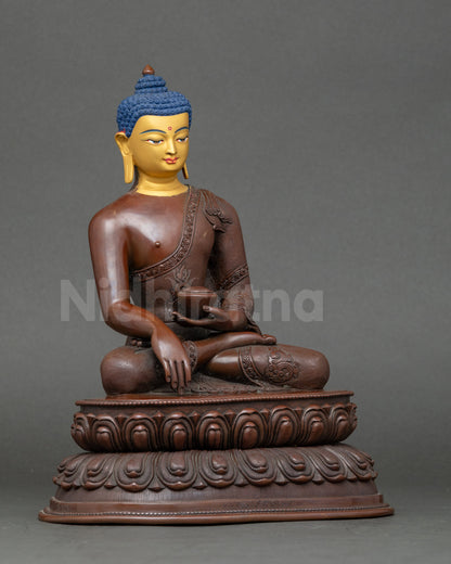 Close view of Shakyamuni Buddha holding monk bowl with antique oxidized finish