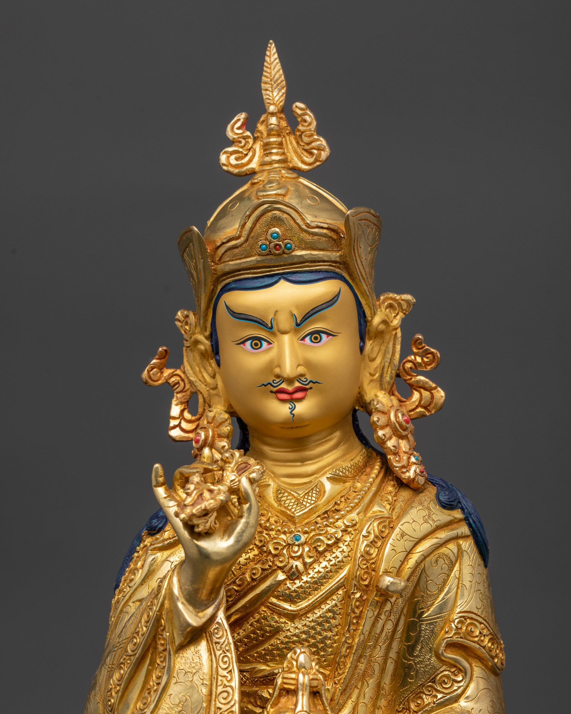 Close view of Tsokye Dorje holding vajra and skull cup gold gilded Himalayan statue