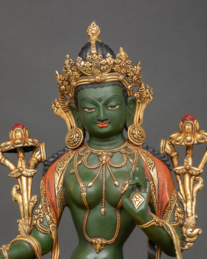 Close view of hand-painted Green Tara sculpture with detailed Nepalese craftsmanship
