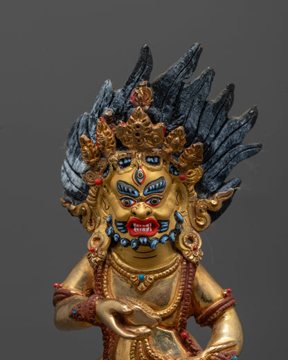 Closed-up Black Dzambhala deity statue crafted using lost wax method featuring gold gilding