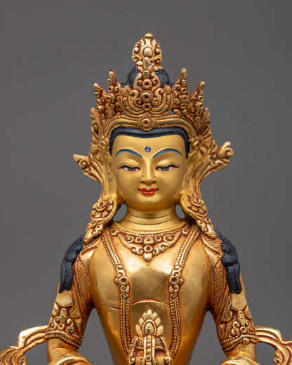 Closeup of Amitayus statue’s sacred Nectar Vase and intricate crown carvings
