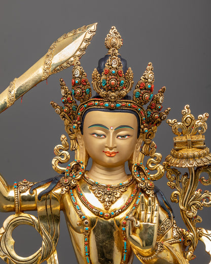 Closeup of Manjushri statue’s gold-gilded face and intricately carved halo details