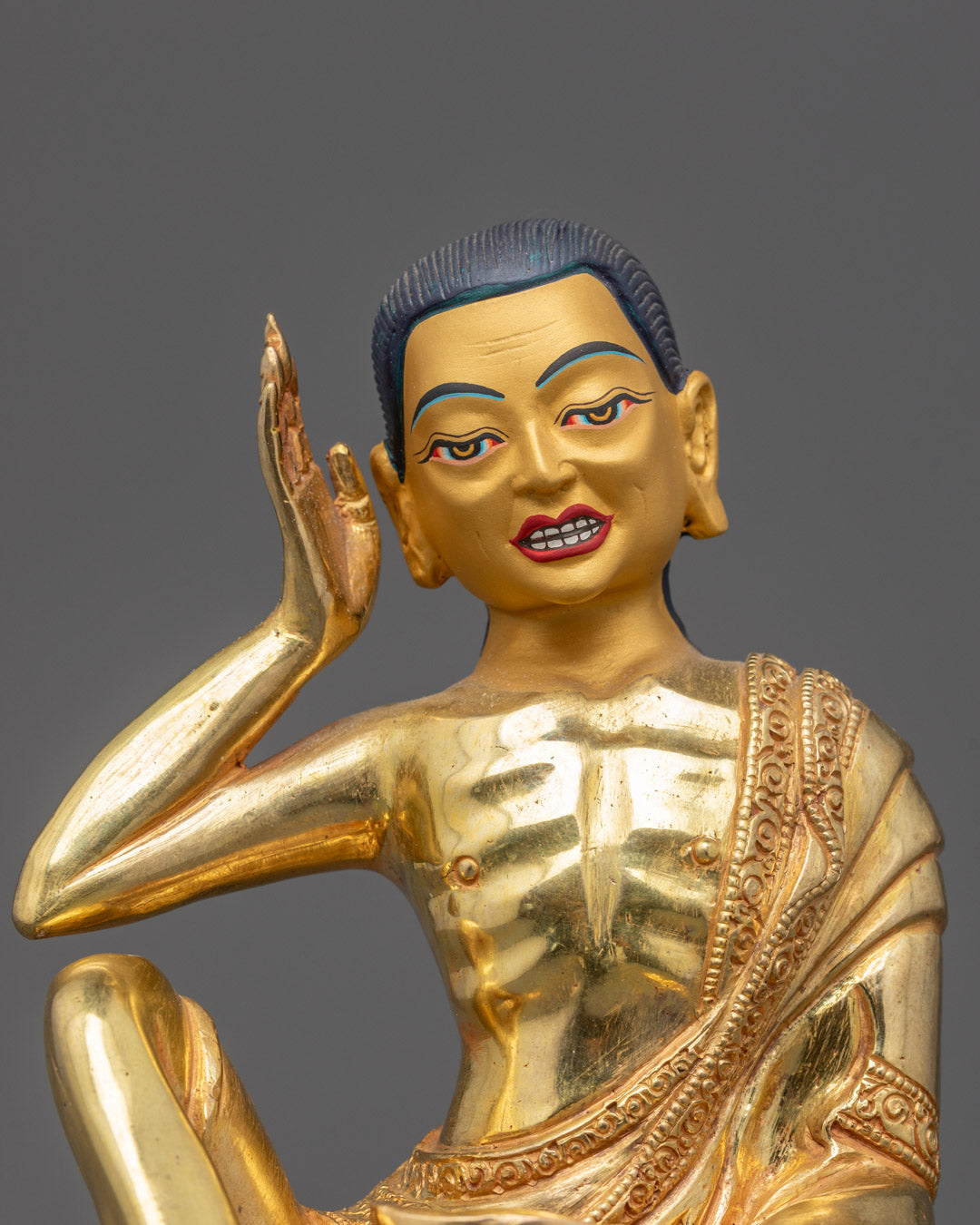 Closeup of Milarepa Statue showing gold fire-gilded body and traditional patra bowl