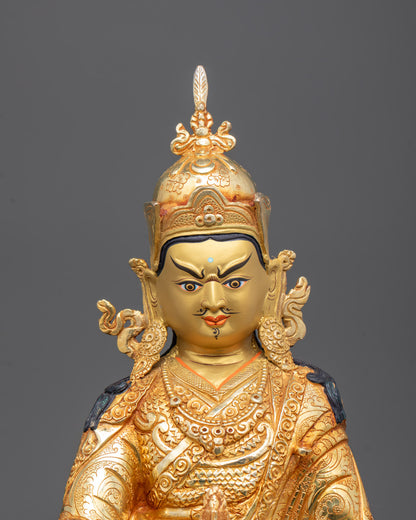 Closeup of Padmasambhava Statue showing intricate carvings and vibrant acrylic paint