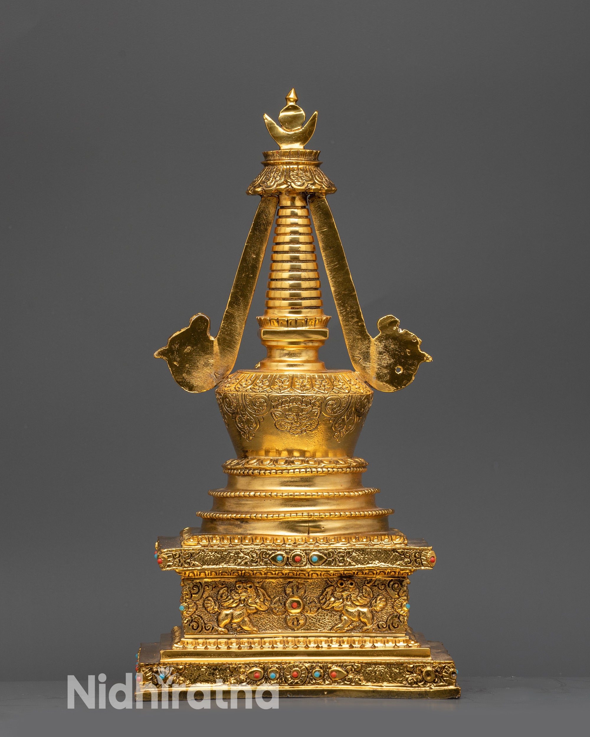Copper Namgyal Victory Stupa with gold gilding and symbolic stone patterns, side angle