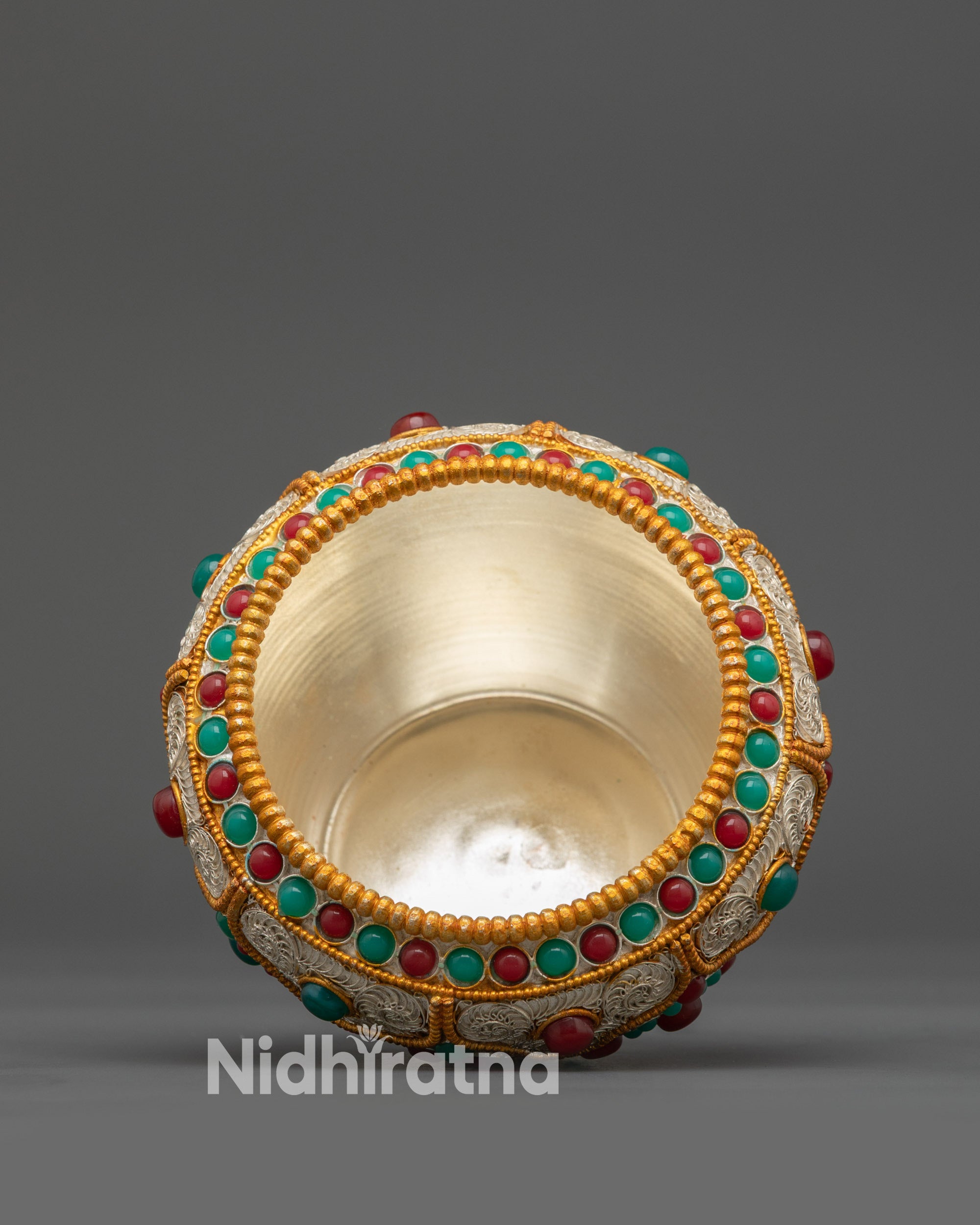 Copper Tibetan ritual pot adorned with emerald and coral semi-precious stones