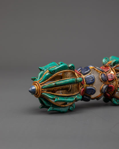 Copper dorje with intricate filigree design, symbolizing strength and protection