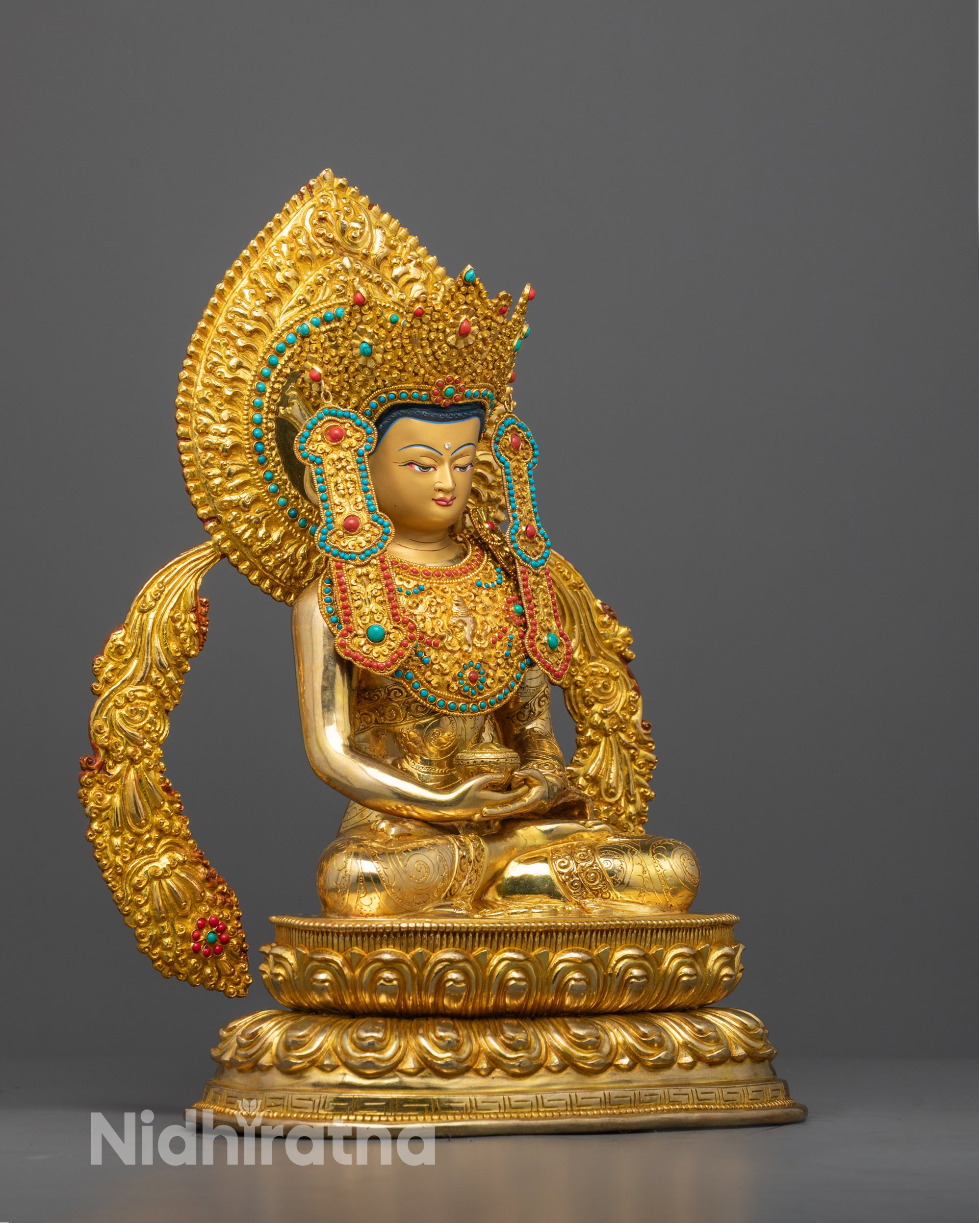 Side angle of Amitabha Buddha showing detailed crown and flowing robe