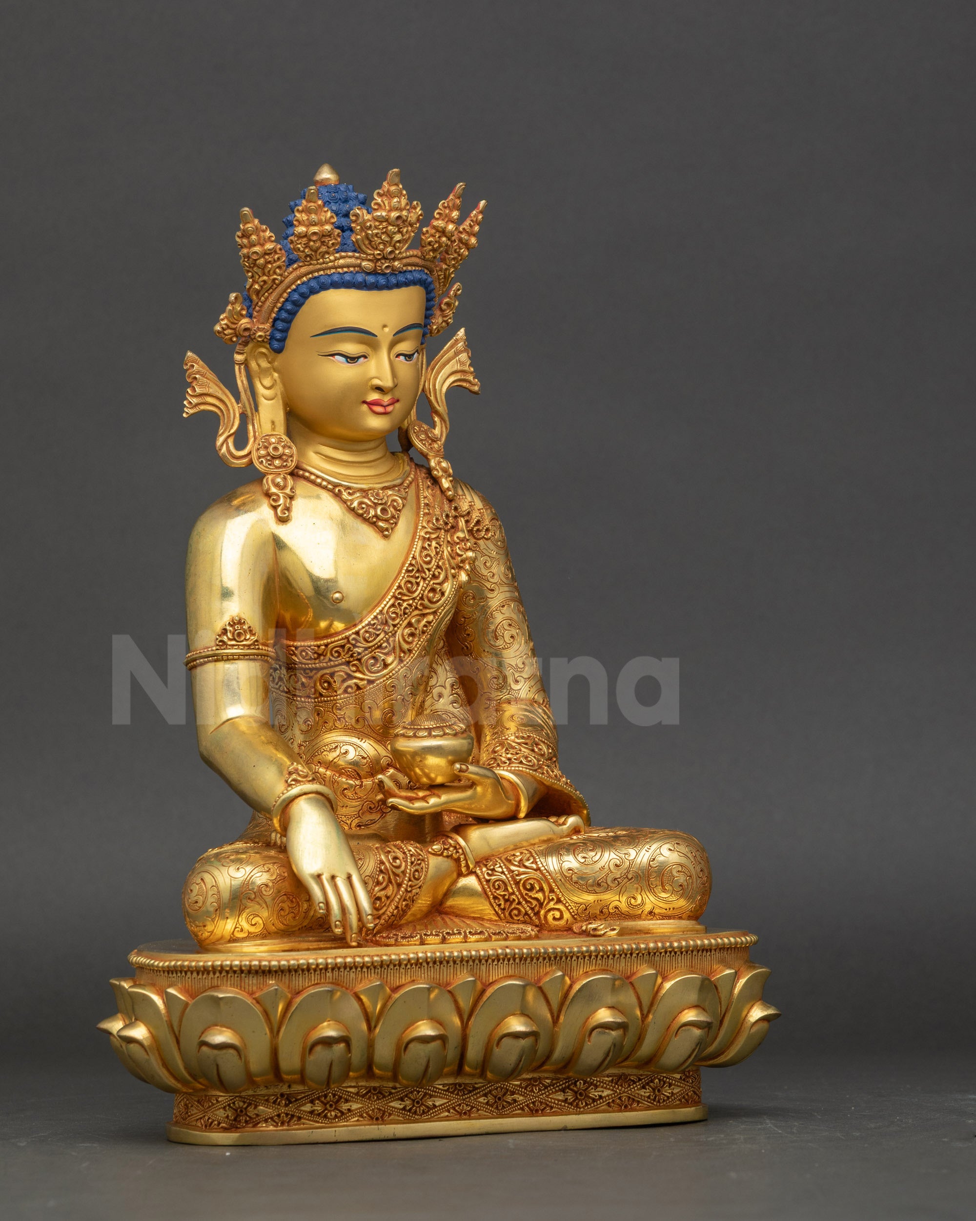 Crowned Buddha Shakyamuni seated on lotus holding patra bowl bhumisparsa mudra