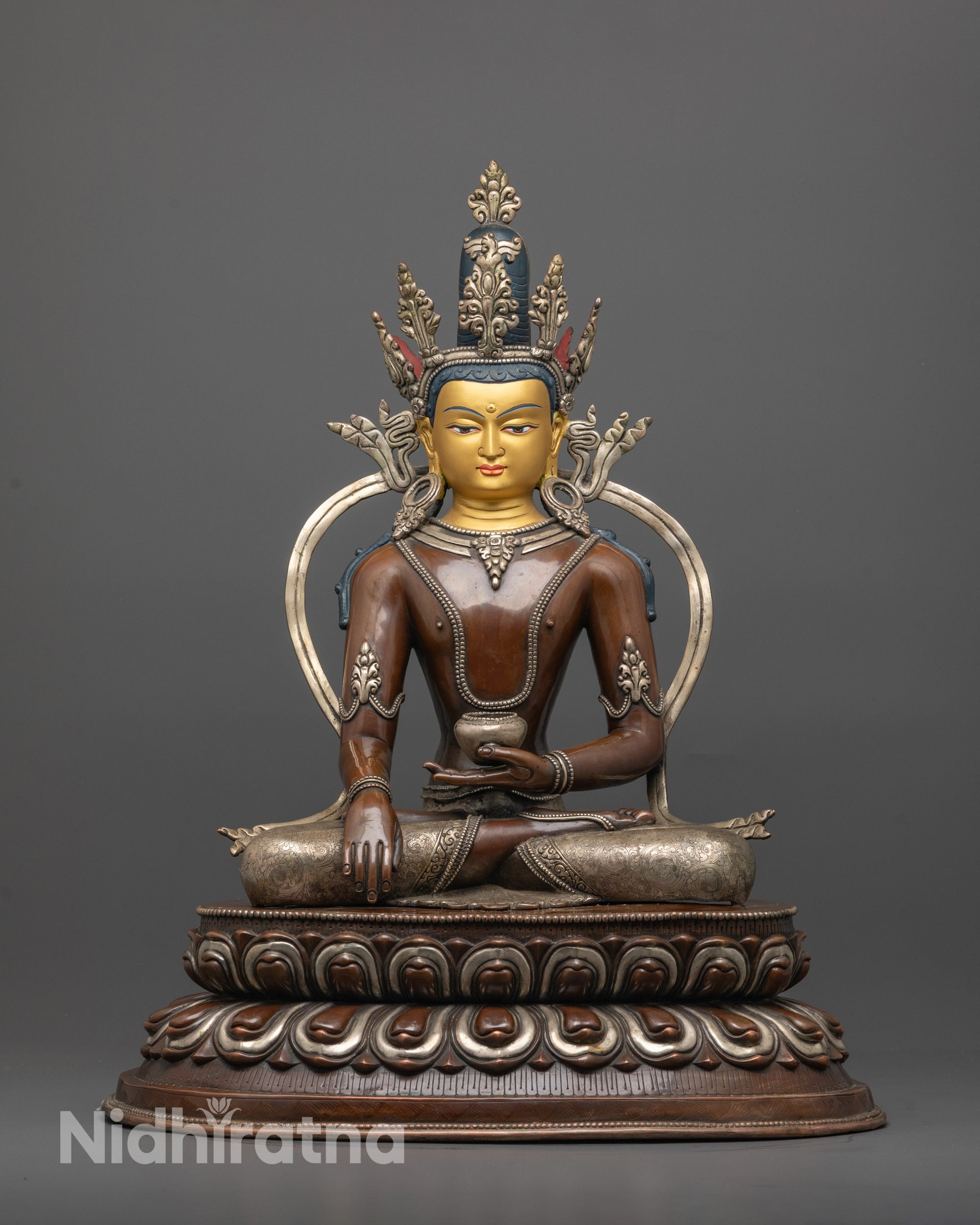 Crowned Shakyamuni Buddha Statue front view with gold face and silver-plated lotus base