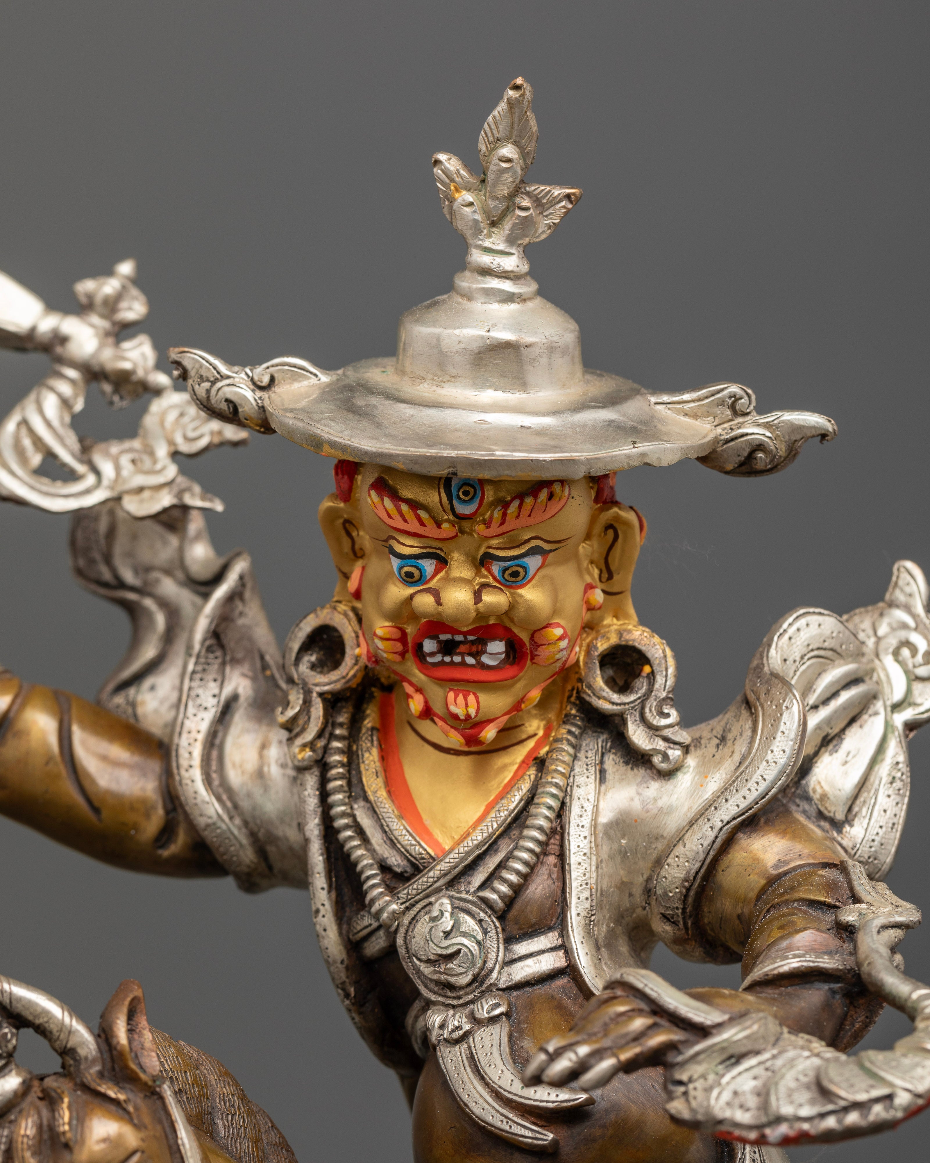 Damchen Garwa Nagpo statue close up handcrafted copper silver details Tibetan guardian sculpture