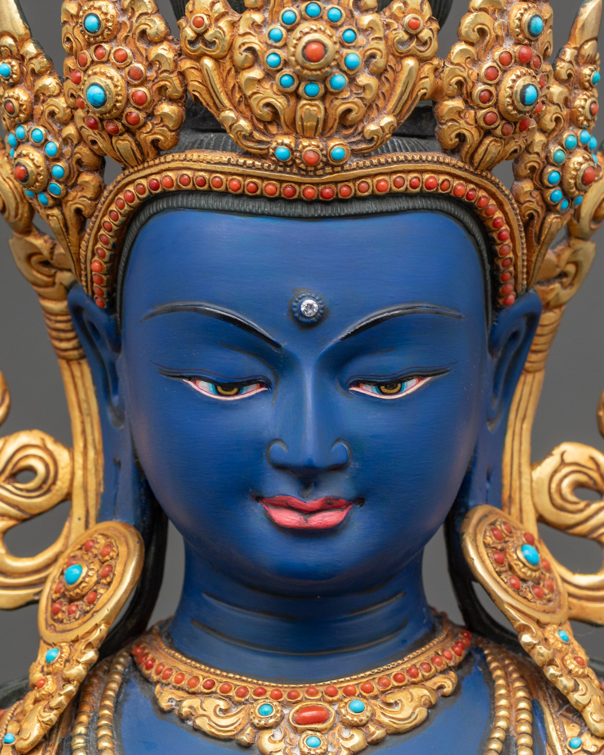 Dark Blue Vajradhara Statue face close up with serene gaze and crown