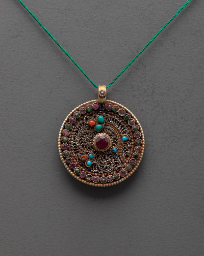 Decorative pendant necklace with gemstones on a gray background