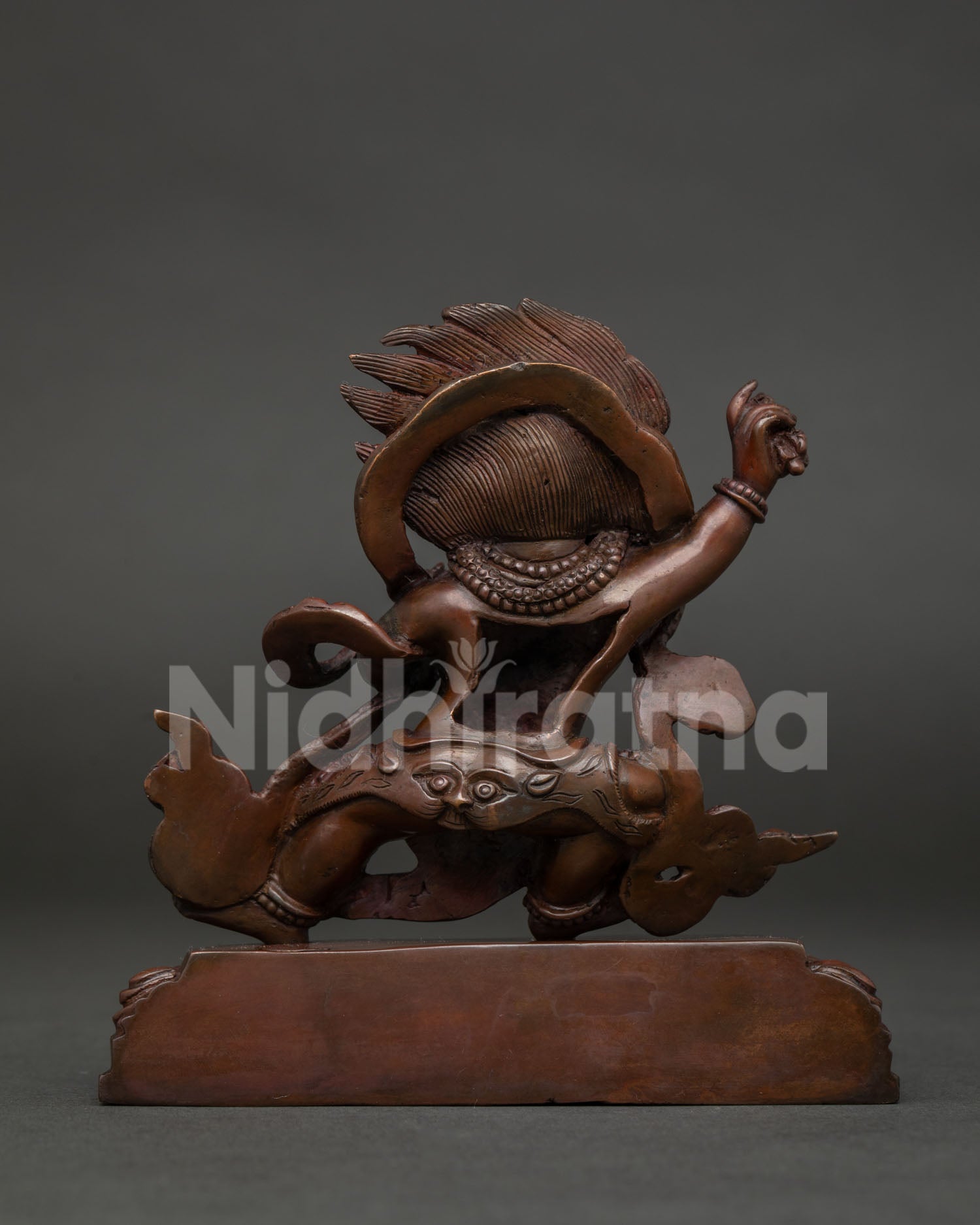 Detailed Vajrapani statue back view showcasing lotus pedestal and traditional Newari craftsmanship.