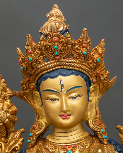 Detailed close-up of White Tara face, 24K gold painted with serene expression
