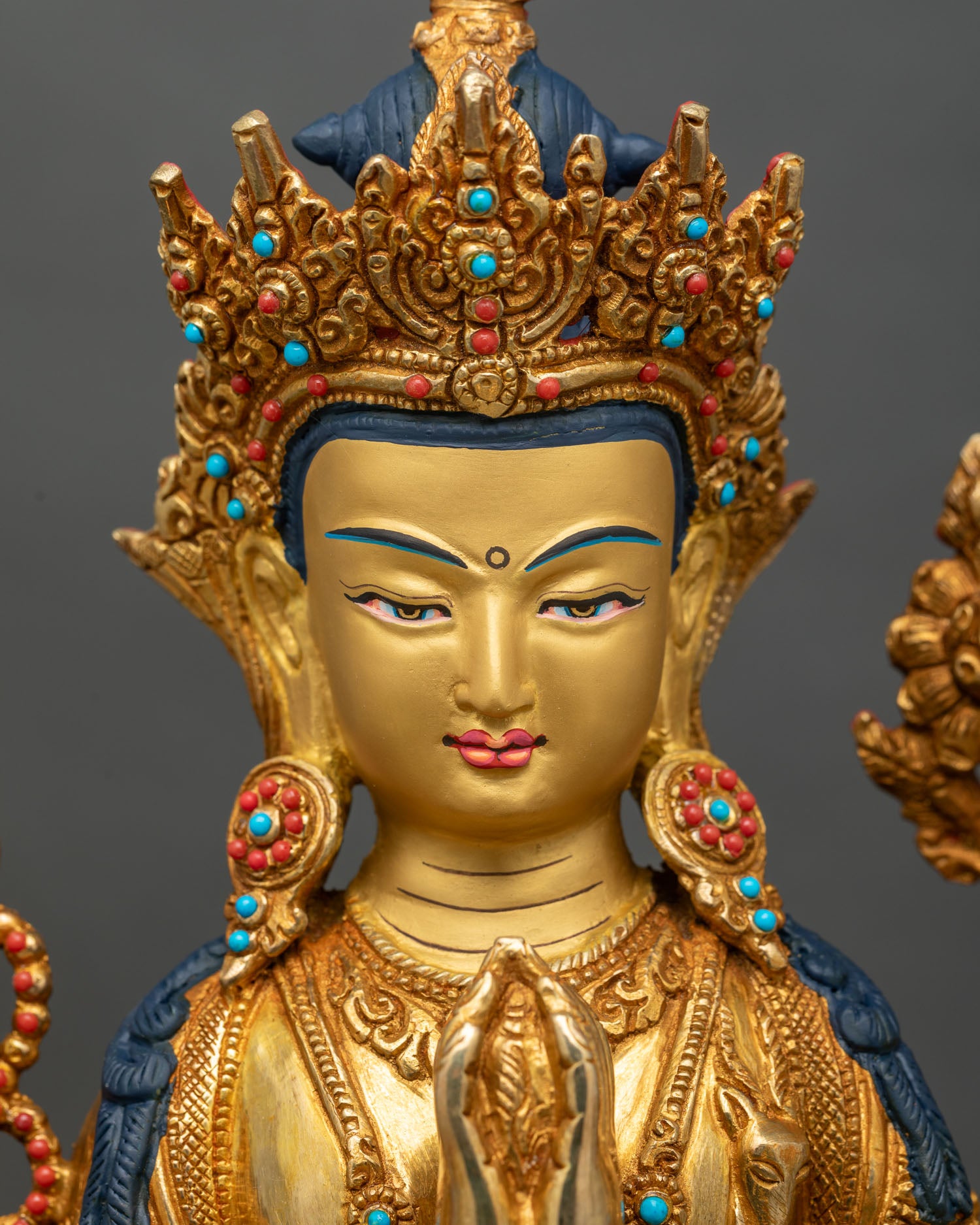 Detailed face close-up of Four-Armed Avalokiteshvara, gold fire-gilded with serene expression