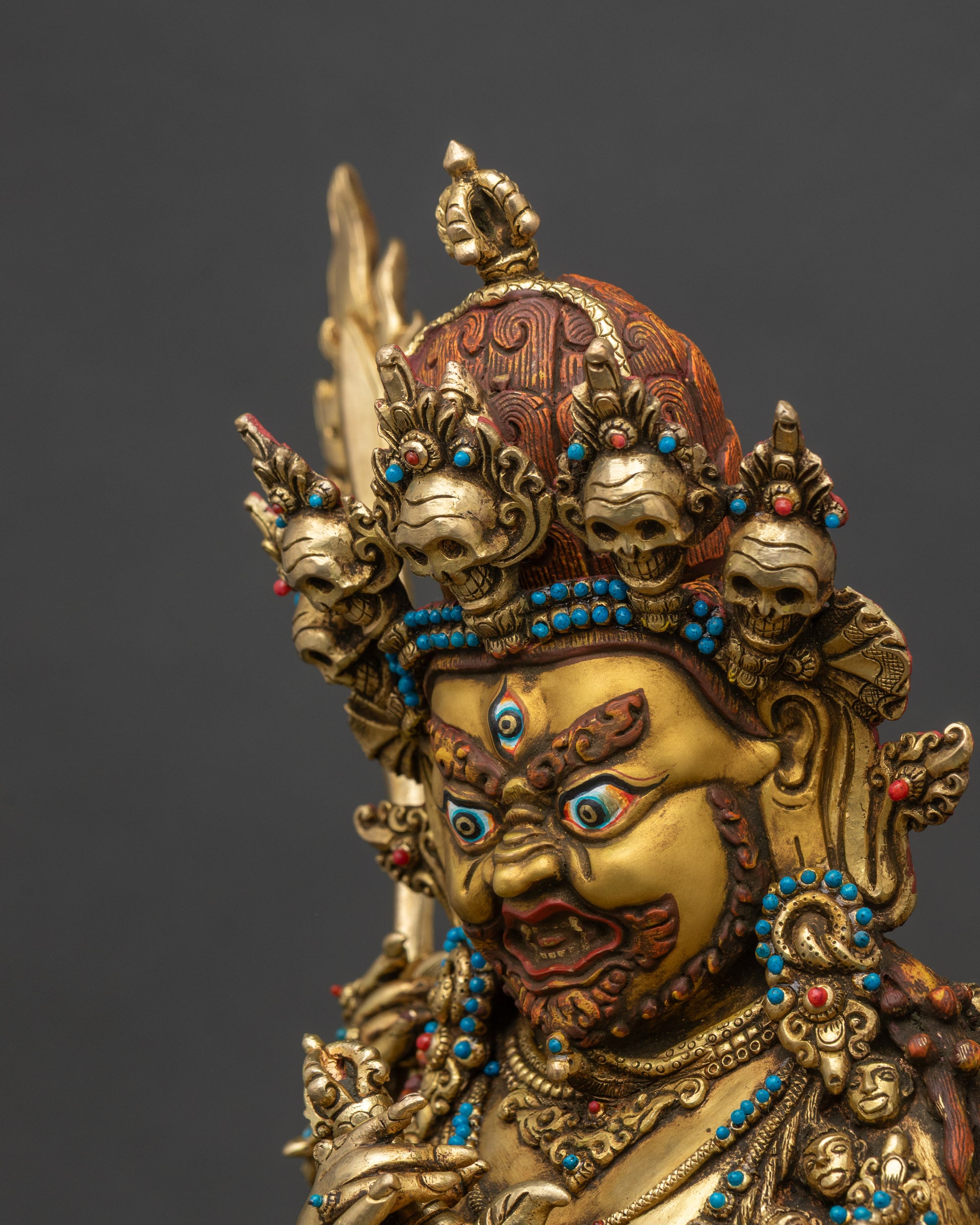 Detailed side close-up of Four-Armed Mahakala Statue, intricate crown and jewelry details