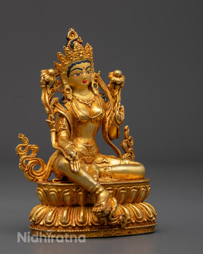 Detailed Carvings of Blue Uptala Flowers, Flowing Robes, and Jewelry on Green Tara Statue