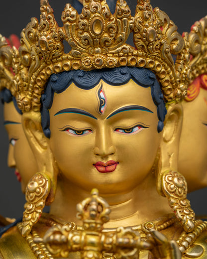 Detailed facial close up of serene 24K gold painted Namgyalma statue