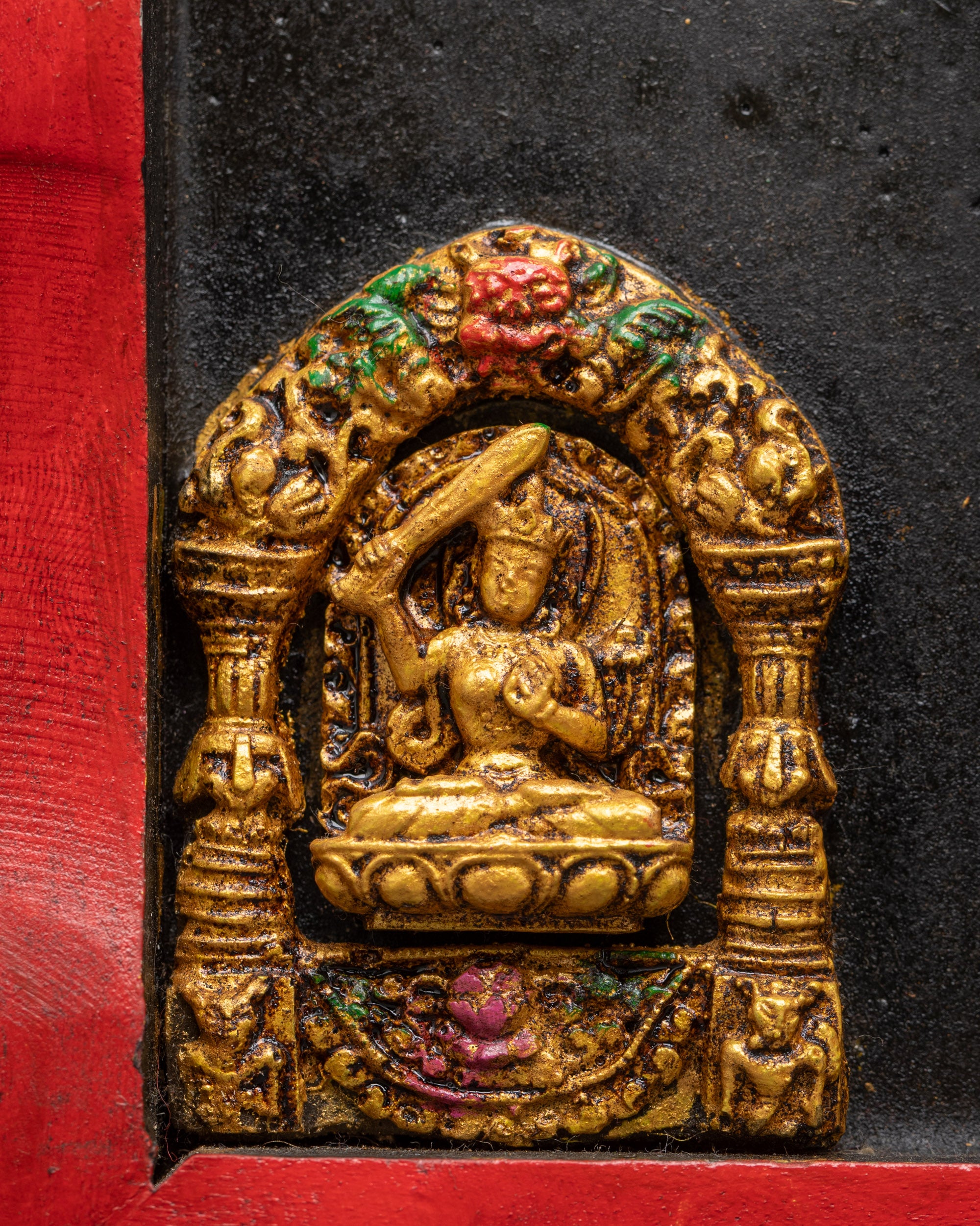 Detailed Manjushri carved on side of Green Tara wooden wall frame
