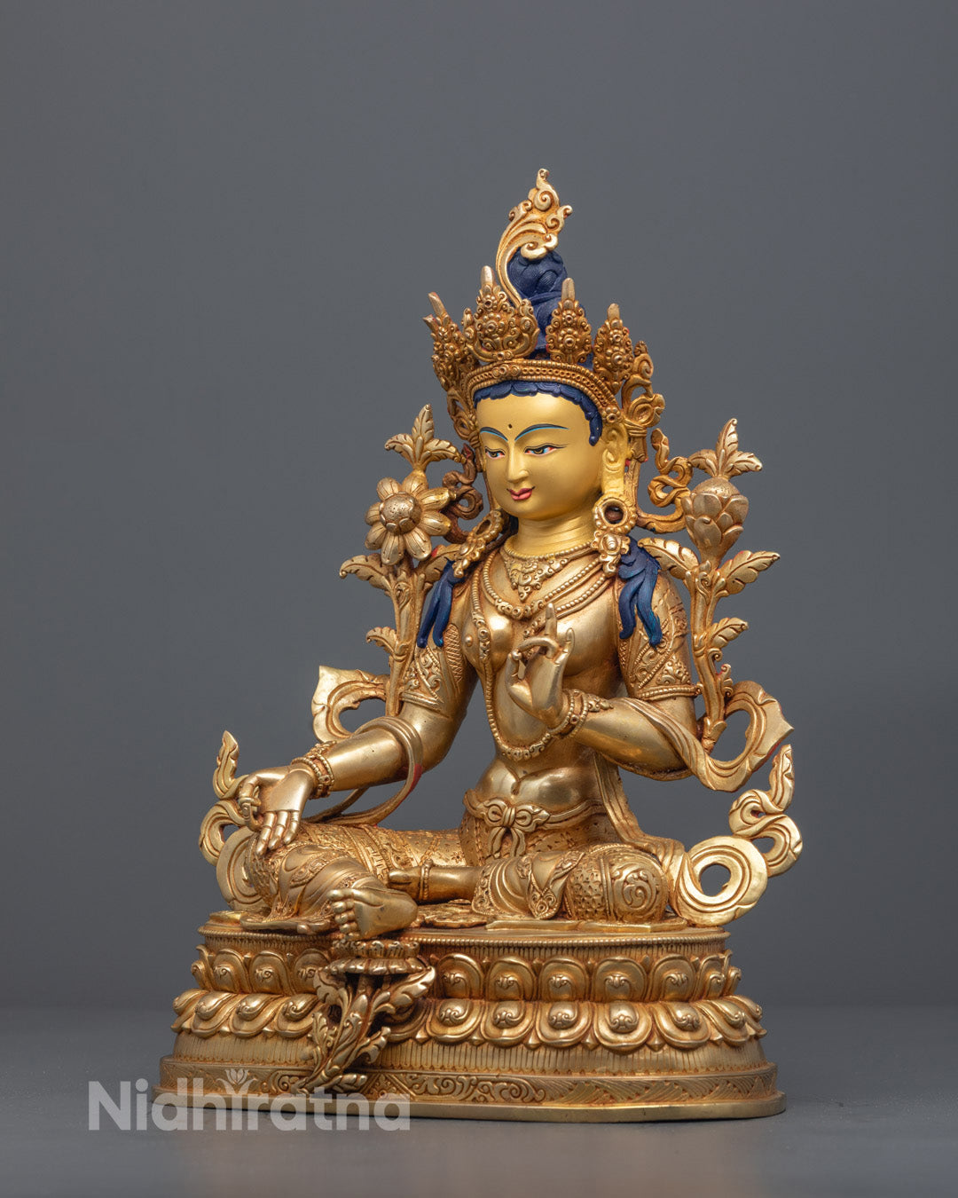 Detailed Nepalese Tara statue adorned with ornate jewelry and serene expression crafted by skilled artisan