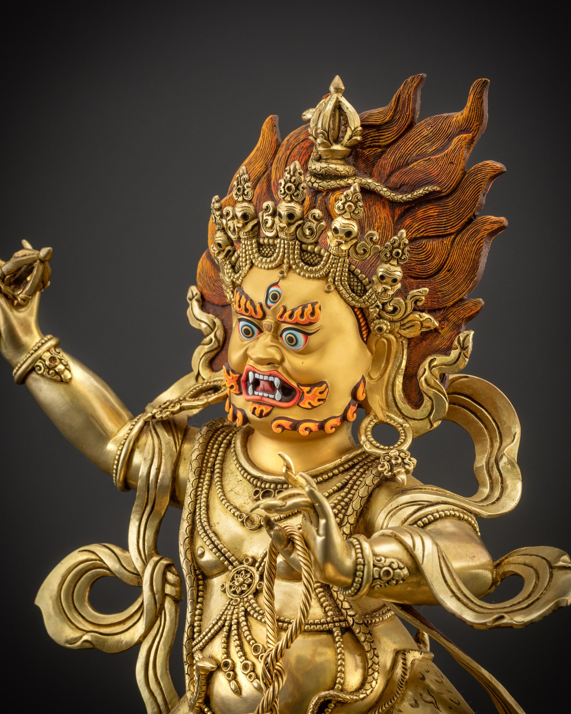 Detailed Side view of Vajrapani statue showing swirling garments and tiger skin
