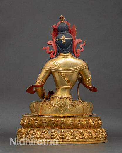 Detailed angle of Vajrasattva idol showing craftsmanship and radiant gold finish