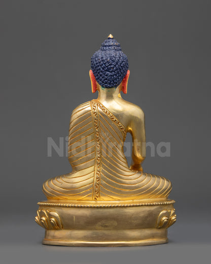 Detailed angle showing lotus seat and gold-gilded craftsmanship of Buddha statue