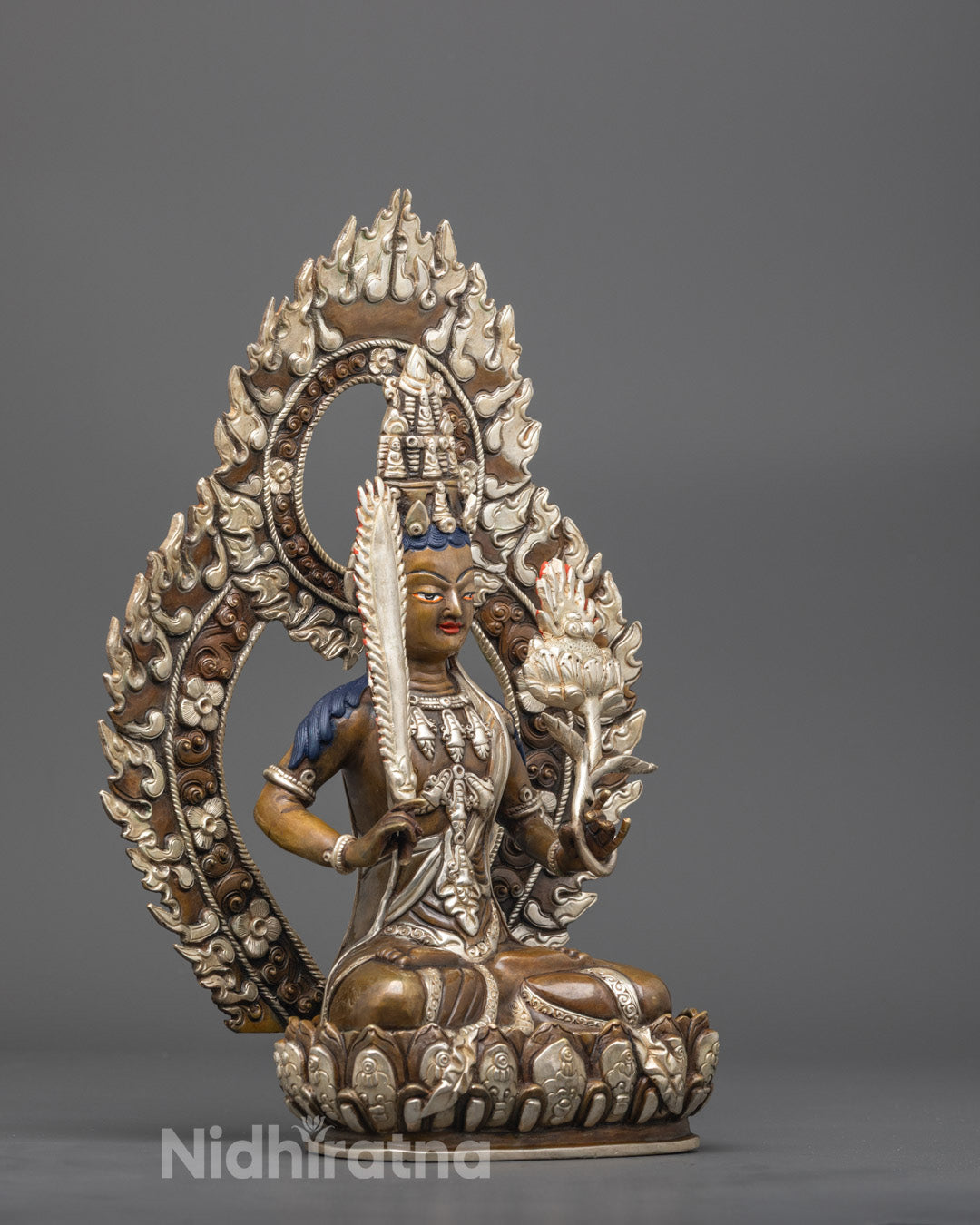 Detailed back angle showing intricate silver carving on crown and halo of Akasagarbha statue