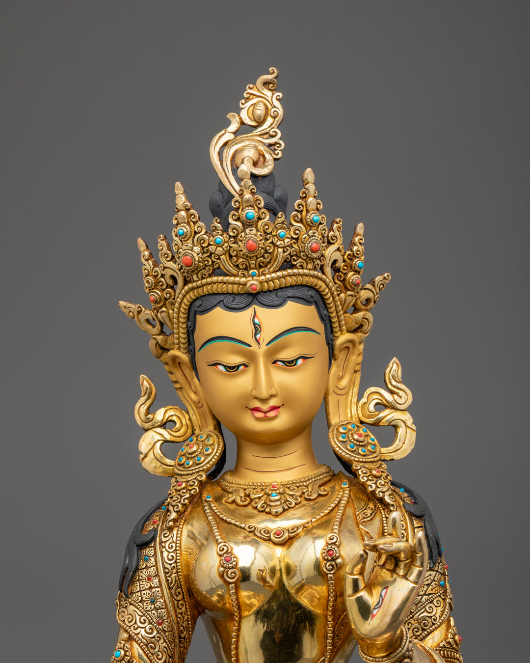 Detailed carving of Sitatapatra Statue’s floating robe and umbrella parasol adorned with semi-precious stones