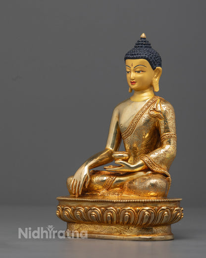 Detailed carving on the robe of Authentic Gautam Buddha Statue made using traditional lost wax casting method by skilled Nepalese artisan.