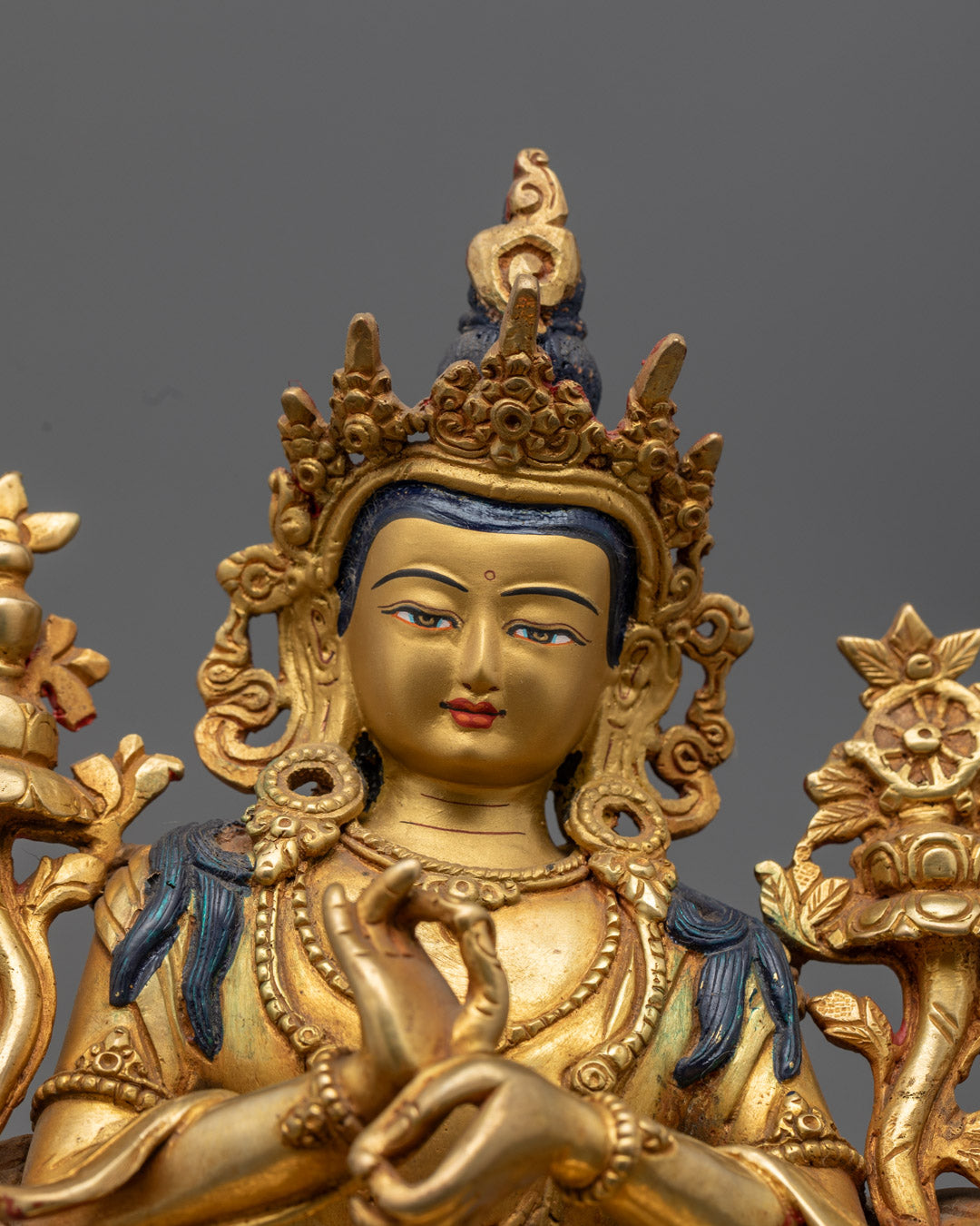 Detailed carvings on Maitreya Buddha’s floating robe (Uttarasanga), jewelry, and majestic crown with delicate uptala flowers