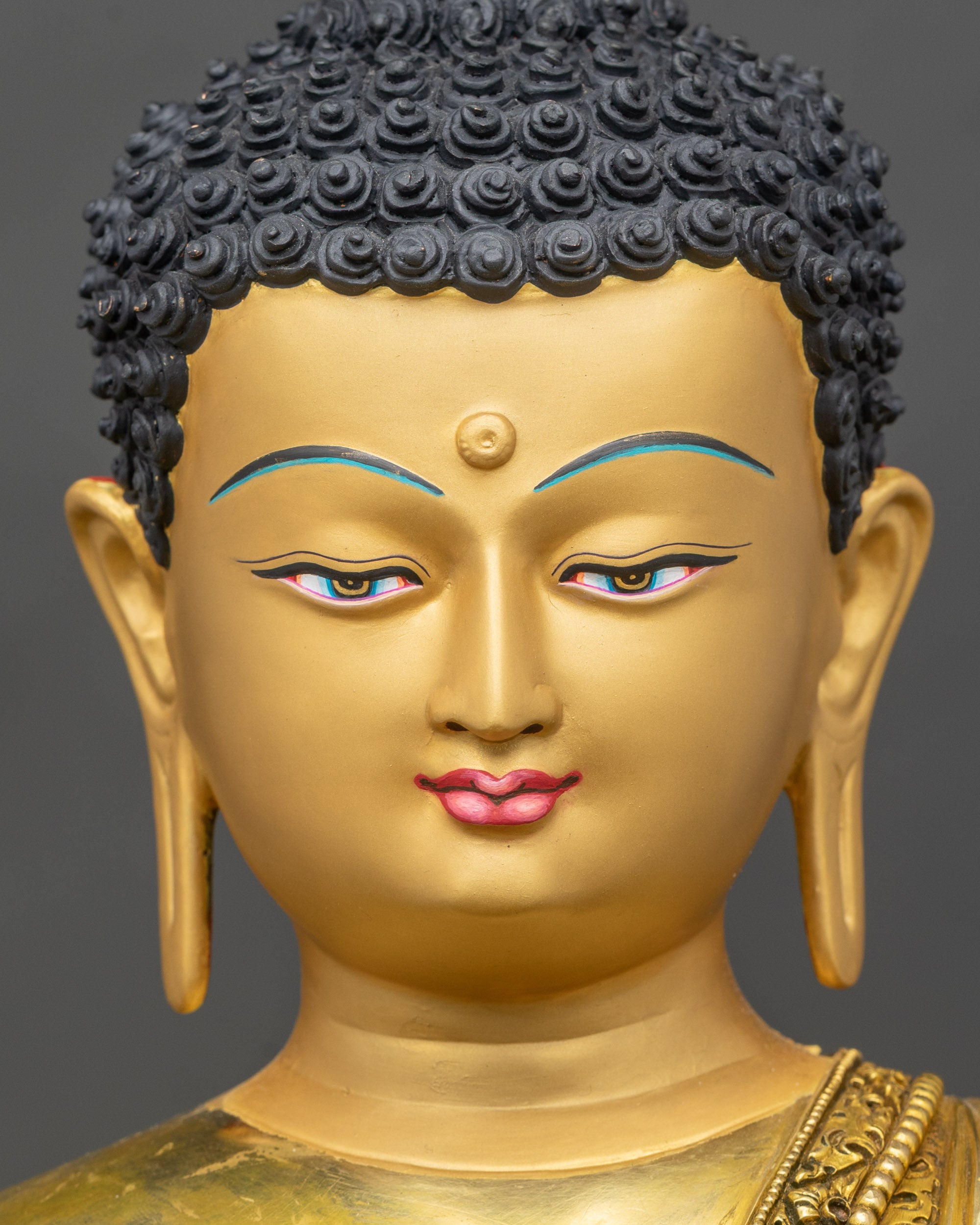 Detailed close-up of Buddha face with serene expression and floral halo