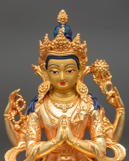 Detailed close-up of Chenrezig face with gold paint and serene compassionate expression