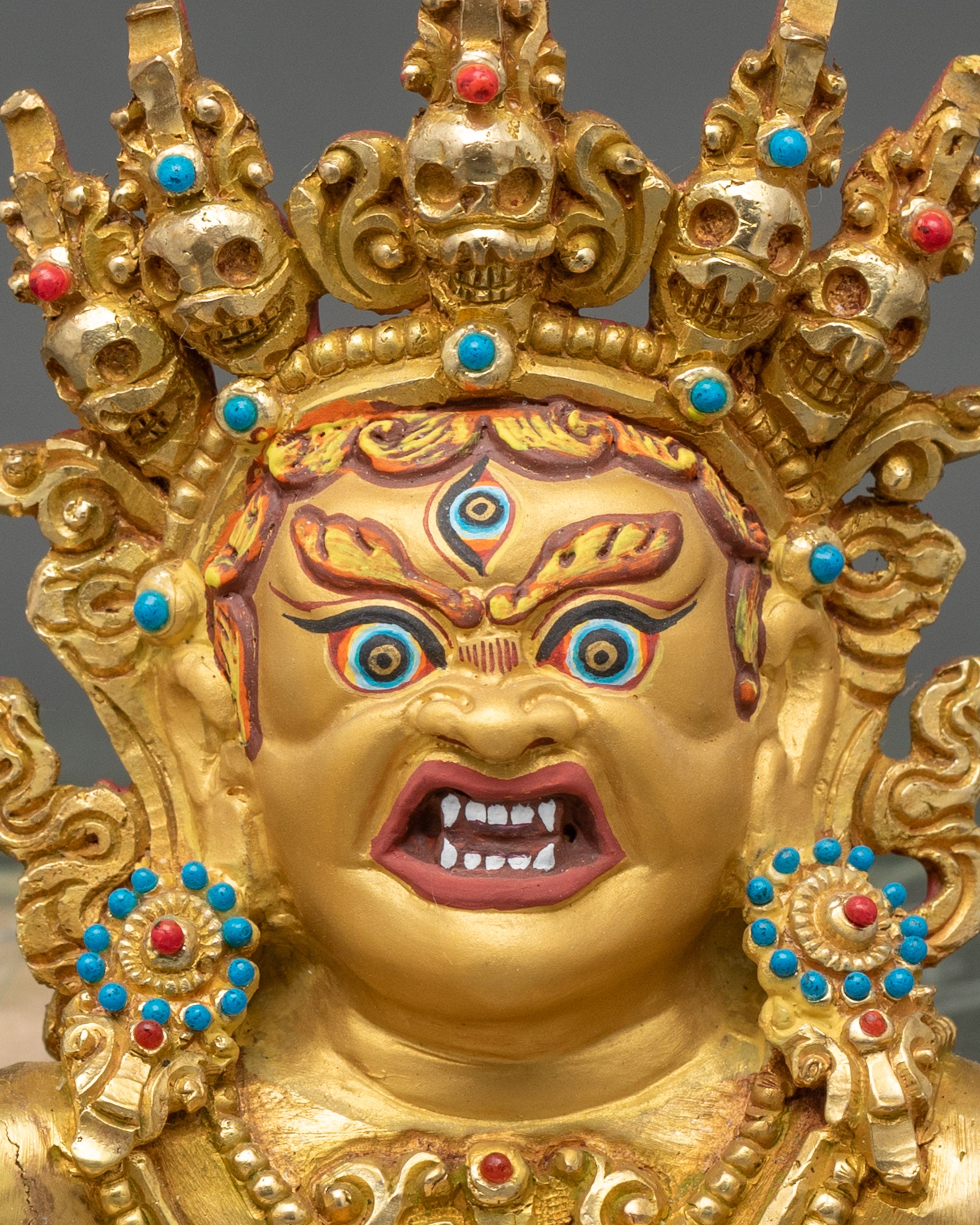 Detailed close-up of Hayagriva Yab-Yum face, gold-painted and wrathful Avalokiteshvara
