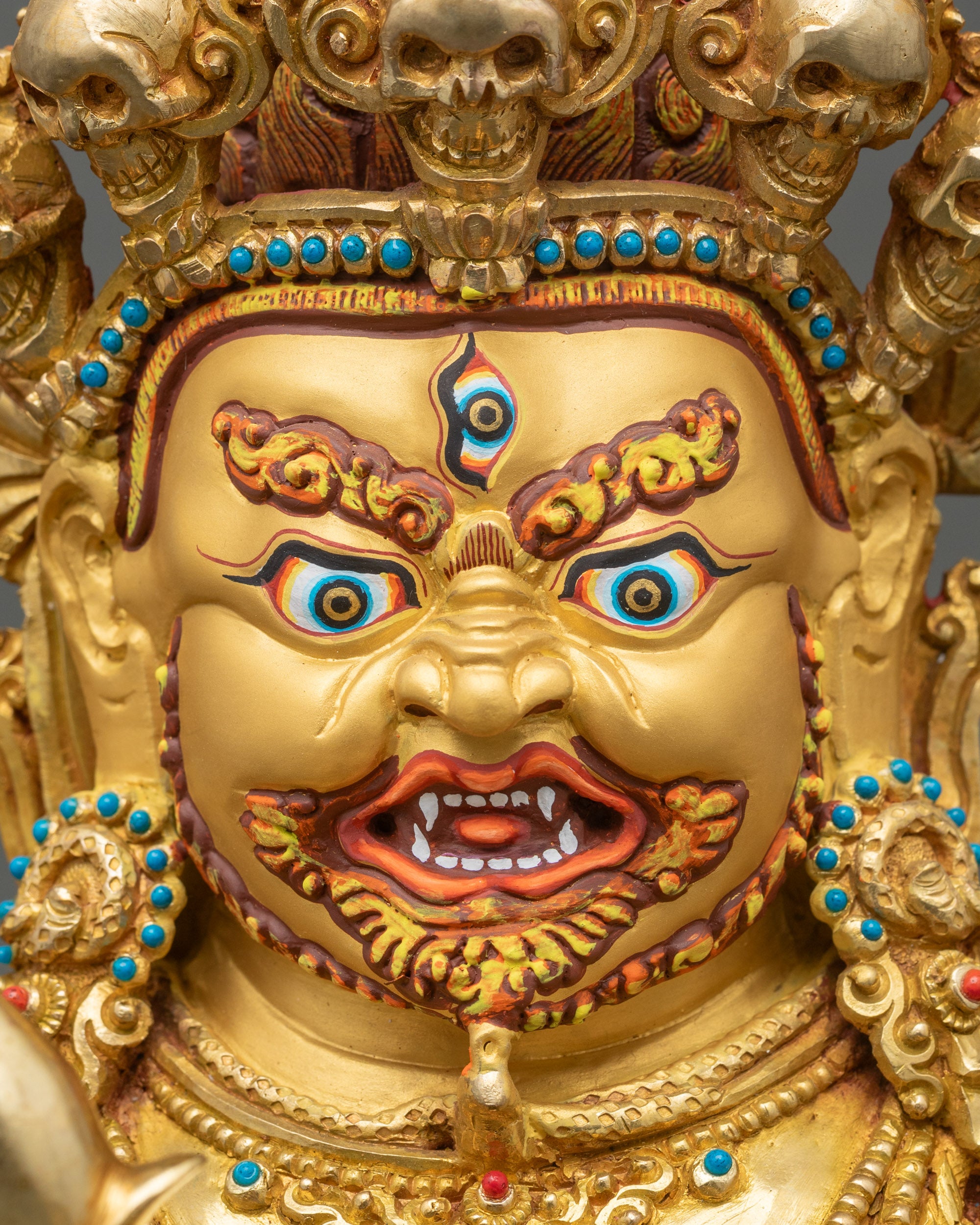 Detailed close-up of Hayagriva face, gold-painted and wrathful Avalokiteshvara